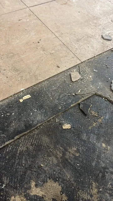 Black bitumen mastic floor removal in a SW7 flat